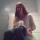 A hidden camera records an attractive woman pissing and shitting while sitting on a toilet. Plops are solid at first, then a load of soft, goopy shit comes out all at once and heard quite well, despite limited audio range. 720P HD. About 3 minutes.